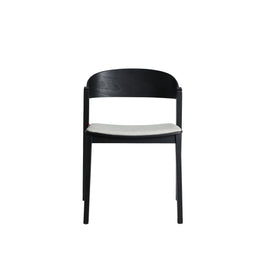 BORKEN CHAIR in a modern interior setting