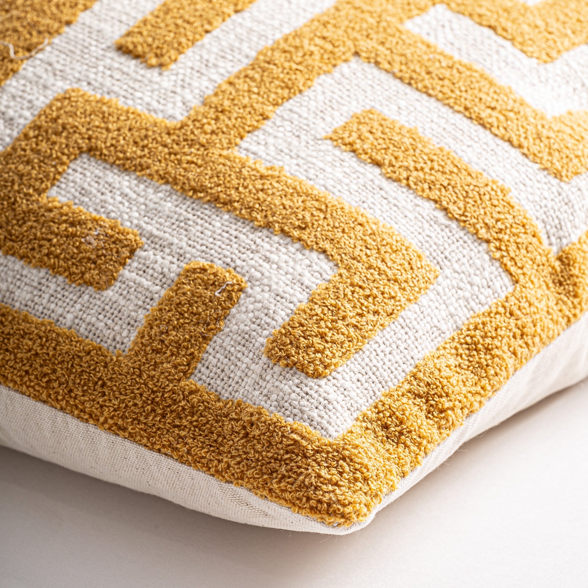 AMAIA CUSHION in a modern interior setting