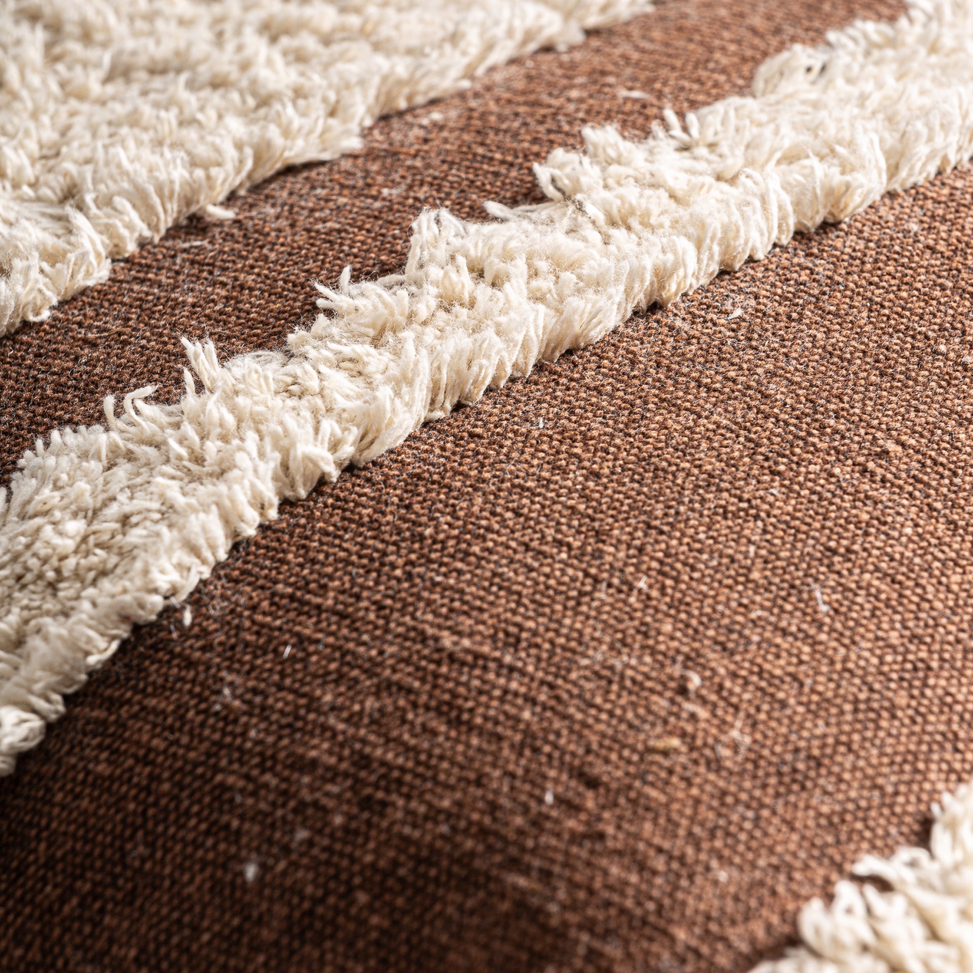 SAHUN CUSHION in a modern interior setting