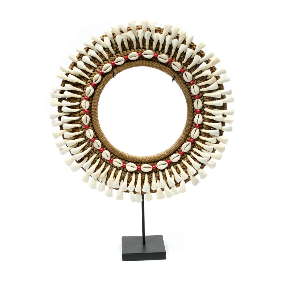 The buffalo-tooth hoop on a stand