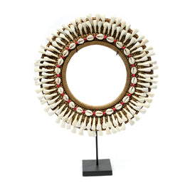 The buffalo-tooth hoop on a stand