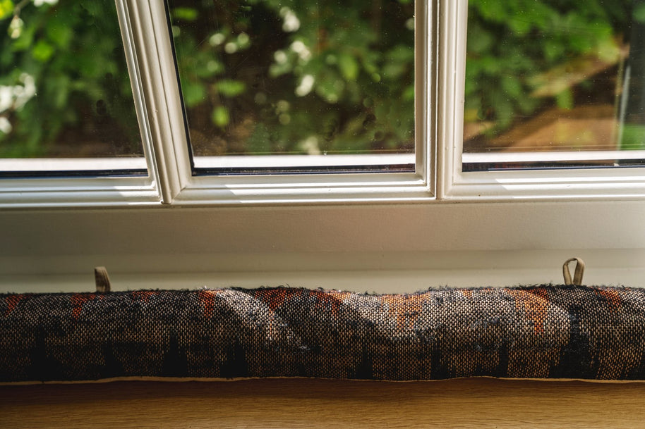 The Oh My Gee Doorstop - Black and Orange